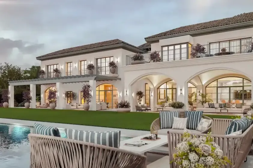 Villa Cerquilla: fachada al jardín con porches en arco, piscina y zona de estar exterior