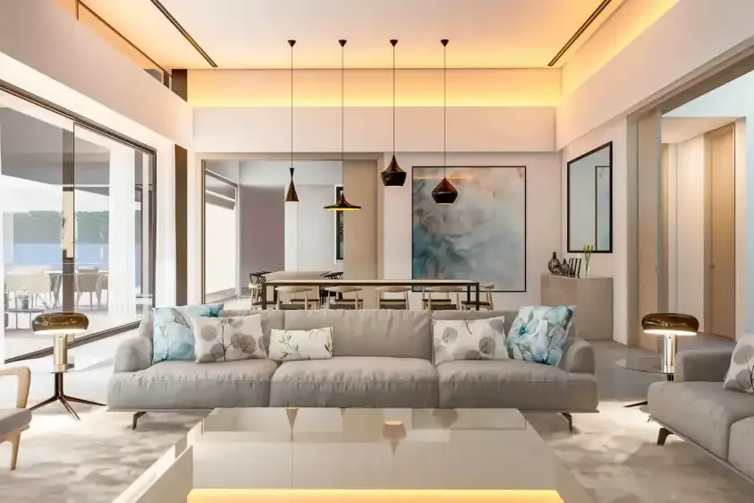 Salón con lámparas colgantes y sofá en L