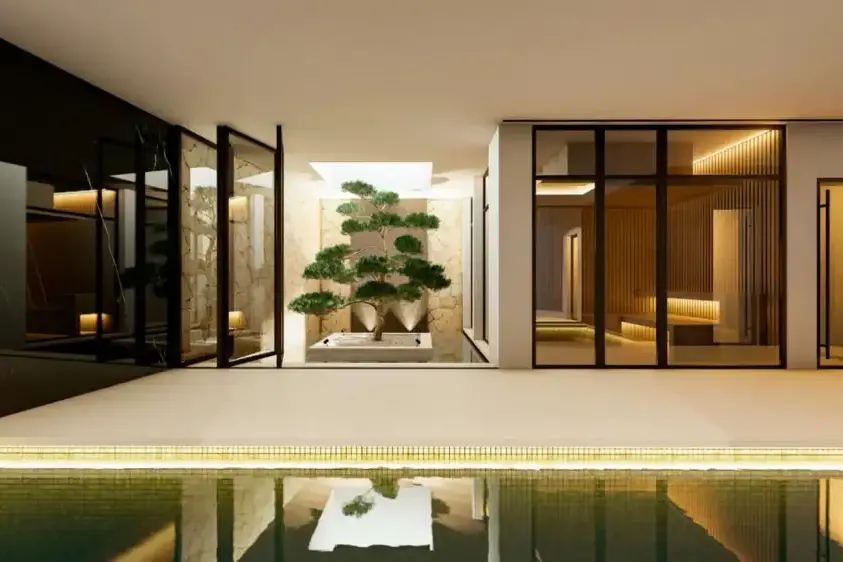Piscina interior con iluminación indirecta y bonsái