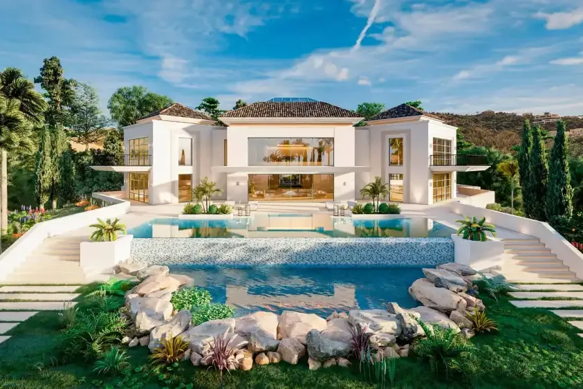 Villa en La Zagaleta (Benahavís): fachada blanca con piscina de roca y jardín tropical