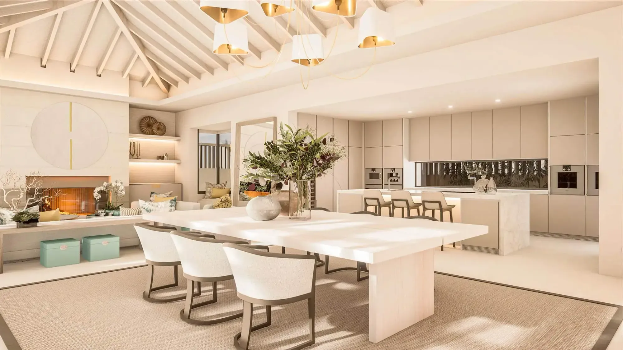Kitchen and dining room at Residencia Pino with a vaulted timber ceiling, kitchen island, white dining table, pendant lights and a fireplace in the background