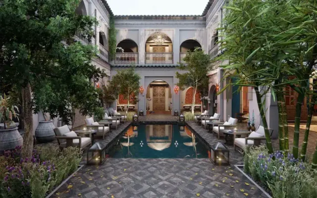 Riad: courtyard with pool, palms and arched gallery