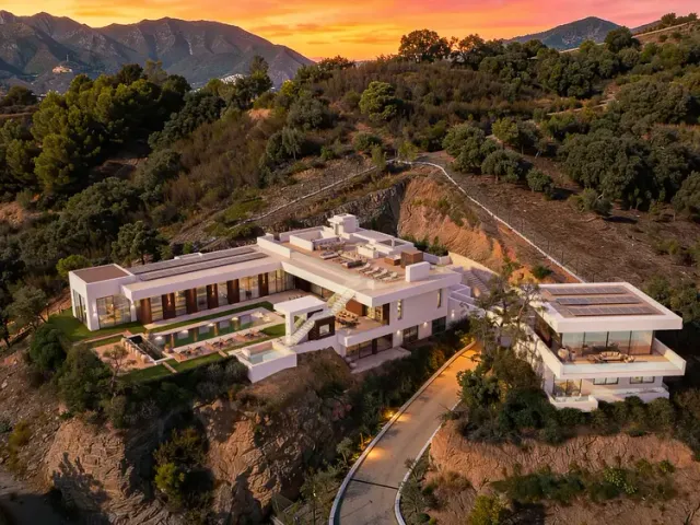 The House (Marbella): aerial view of the hillside villa at sunset