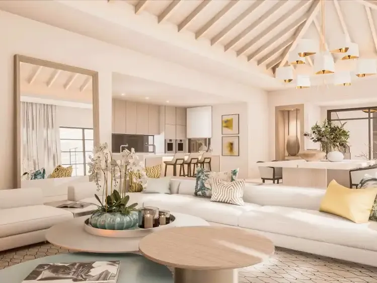 Double-height living room with pitched ceiling and pale sofas